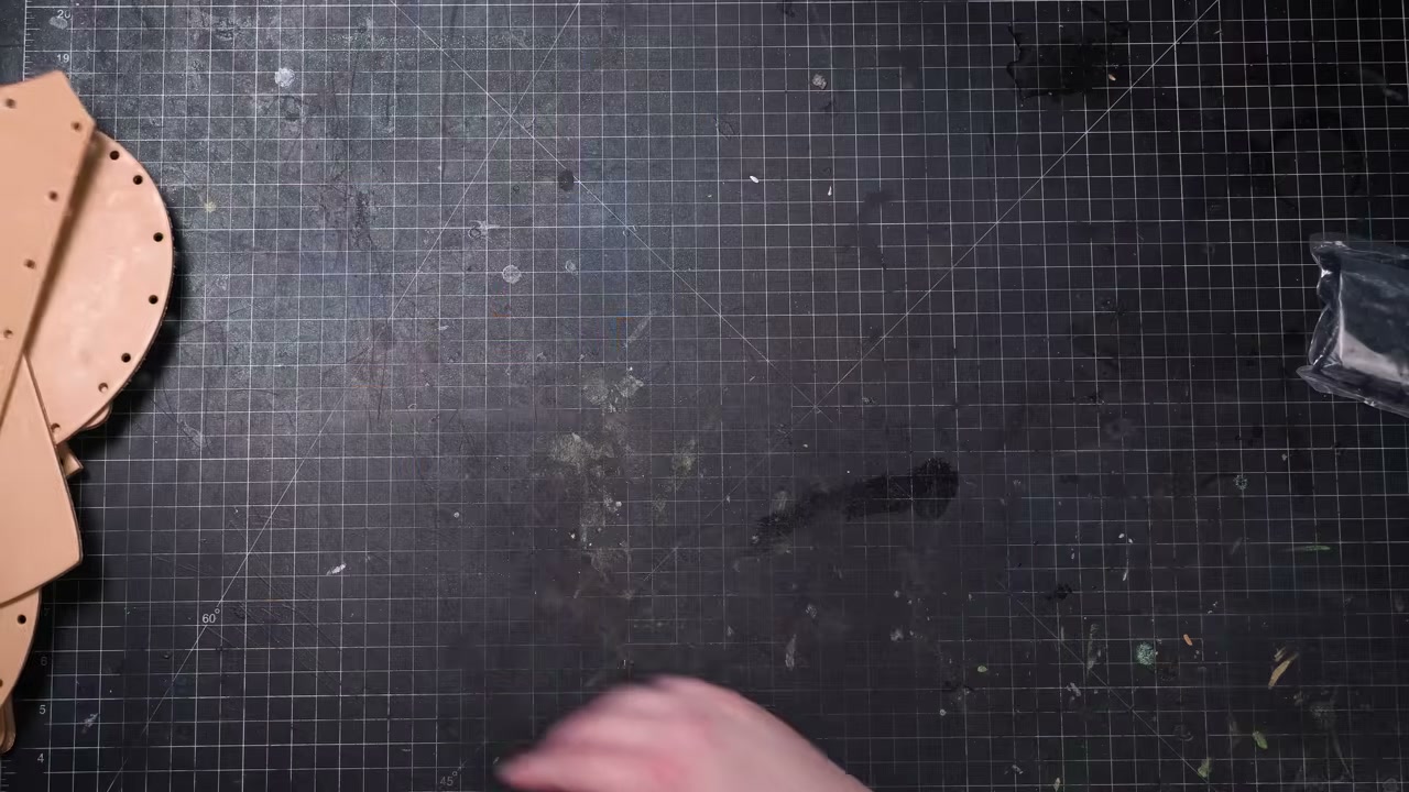 Warrior Helmet Build Guide: A Real Leather Helmet with Just a Hammer 4 Dunking pre-cut helmet pieces in a tub of water