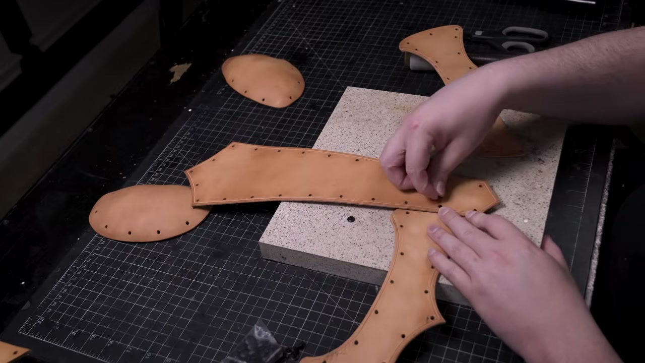 Warrior Helmet Build Guide: A Real Leather Helmet with Just a Hammer 8 Setting a double-cap rivet with a hammer on a granite slab