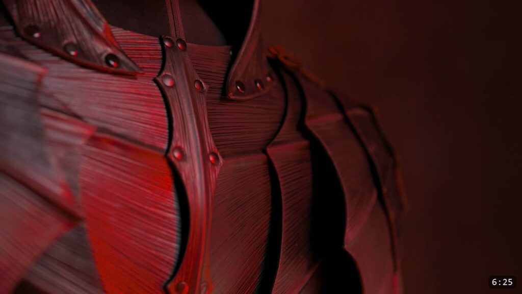 a preview of the full Berserk armor set under red light, articulated leather plates across the torso and shoulders