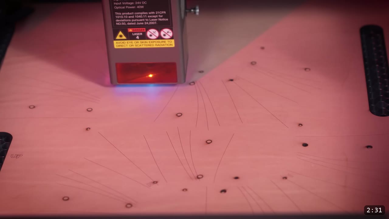 Berserk Gauntlets Build Guide: The Leather Version, Step by Step 4 a 40W diode laser head over a sheet of leather scored with guidelines and cut holes for the gauntlet pieces