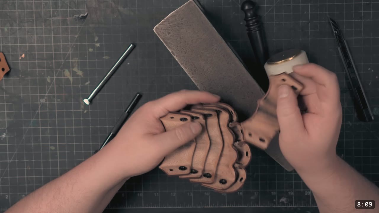 Berserk Gauntlets Build Guide: The Leather Version, Step by Step 6 hands tooling a natural veg-tan gauntlet plate with fluted scale lines on a stone slab, a modeling tool and swivel knife nearby