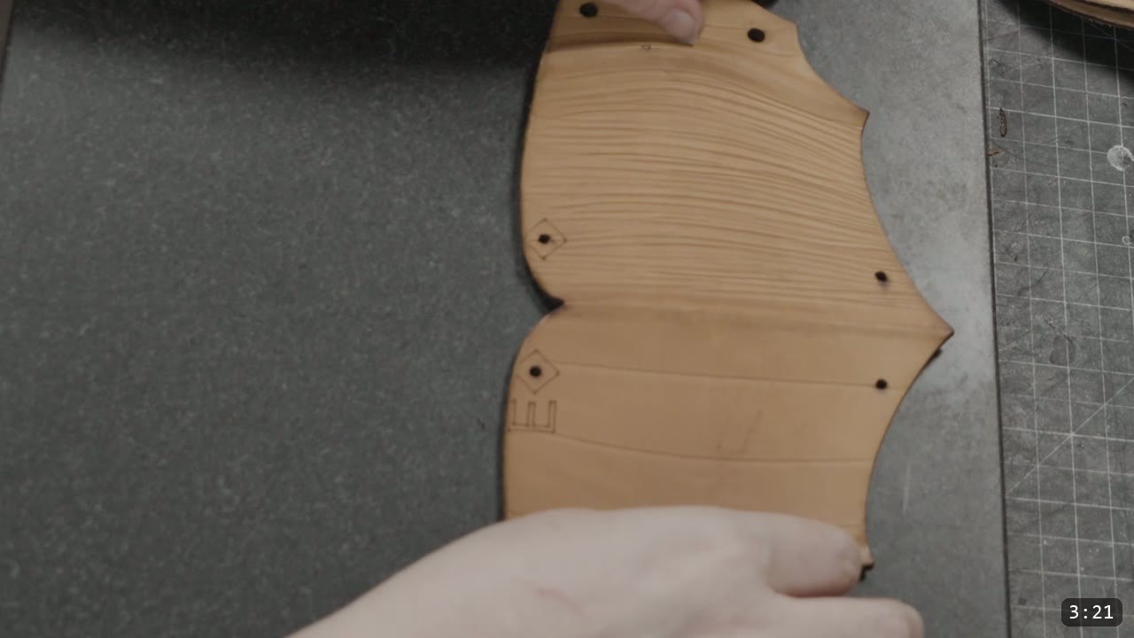 Berserk Greaves Build Guide: Leather Berserker Shin and Calf Armor 6 a natural tan greave piece showing the deep horizontal fluted ridge texture, with diamond-marked rivet holes and reference lines