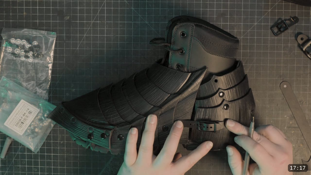Leather Sabatons Build Guide: Berserk Foot Armor from a Flat Pattern 15 the finished black articulated sabaton fitted over a laced boot, with a side buckle strap and fluted overlapping plates