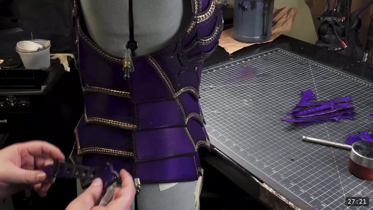 Female Leather Breastplate Build Guide: Articulated Fantasy Armor, Step by Step 16 the assembled purple and gold articulated breastplate on a gray dress form while a side buckle strap is fitted