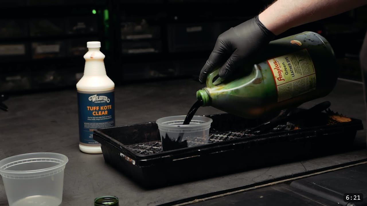 gloved hand pouring Angelus green leather dye into a cup over a mesh tray, a bottle of Weaver Tuff Kote Clear finish standing to the left