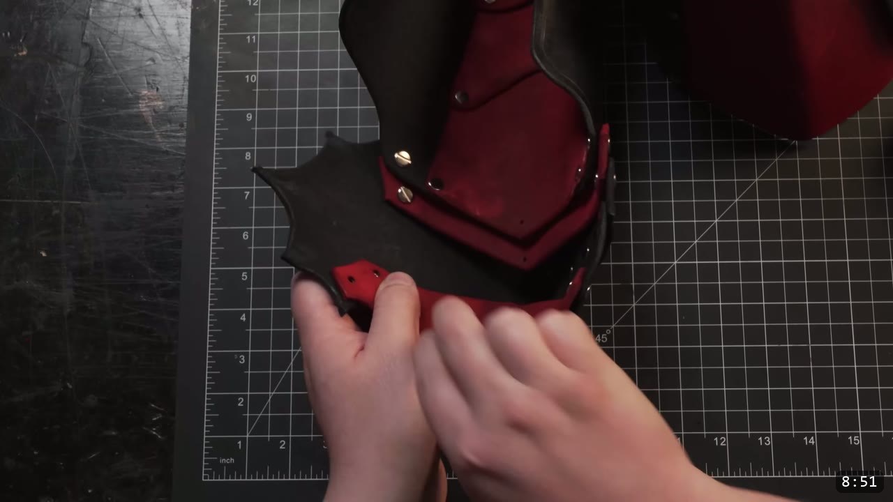 Leather Arm Armor Build Guide: Fantasy Vambrace, Rerebrace, and Elbow 11 the articulated elbow section assembled, a black barbed plate over a red layer joined with brass Chicago screws