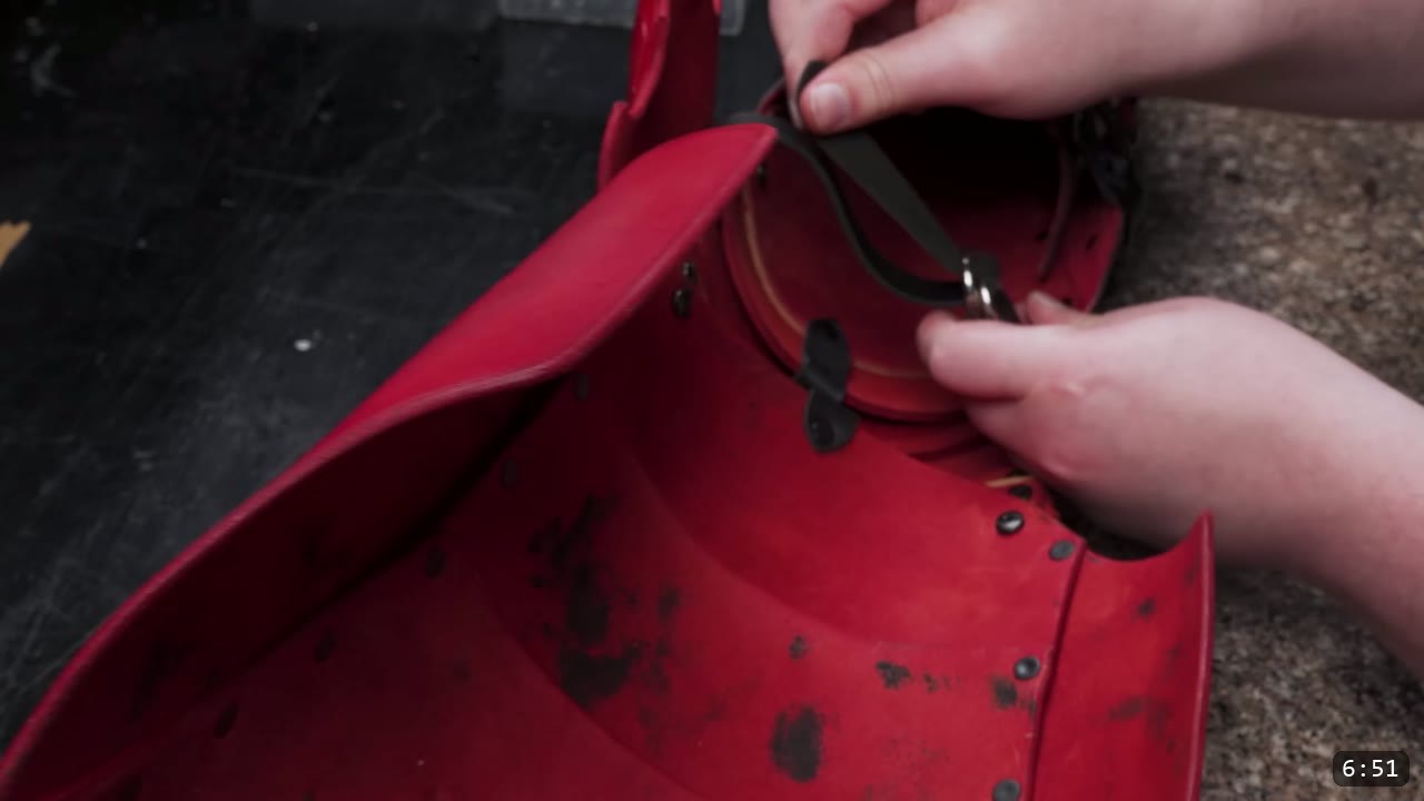 Leather Cuisses and Knees Build Guide: Articulated Upper-Leg Armor 10 attaching a black strap and D-ring to the inside of a red cuisse panel