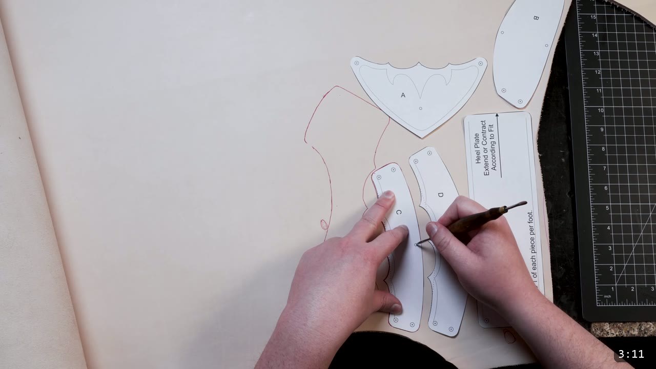 Leather Sabatons Build Guide: Foot Armor from a Flat Pattern 4 pattern pieces laid on a natural veg-tan side and traced with red guide lines, a cutting mat and ruler alongside