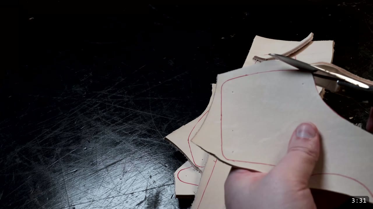 Leather Sabatons Build Guide: Foot Armor from a Flat Pattern 5 cutting a traced sabaton piece out of veg-tan with leather shears over a black slab