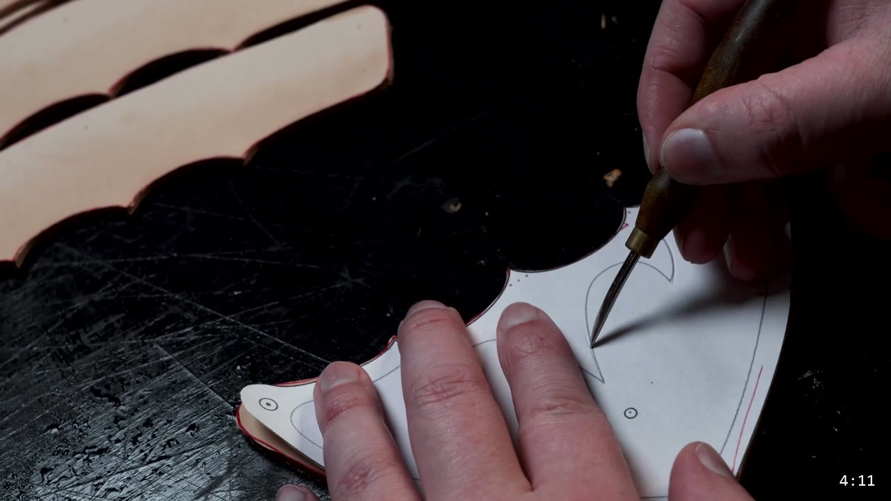 Leather Sabatons Build Guide: Foot Armor from a Flat Pattern 6 carving the barbed toe design into a leather piece with a swivel knife, cut lames stacked nearby