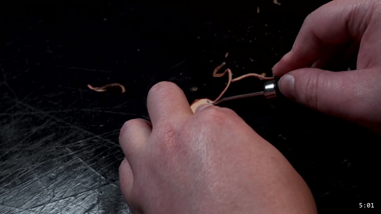Leather Sabatons Build Guide: Foot Armor from a Flat Pattern 7 an edge beveler pulling a thin curl of leather off the edge of a cut piece