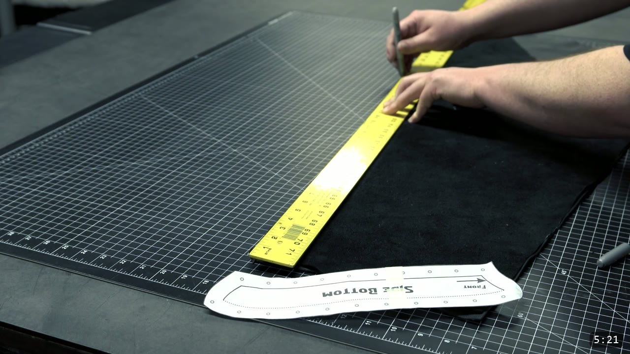 Leather War Belt and Skirting Build Guide: A Fantasy Armor Waist from a Pattern 12 measuring and marking the black chrome-tan skirt leather with a yellow ruler and a marker, a Side Bottom pattern piece on the cutting mat