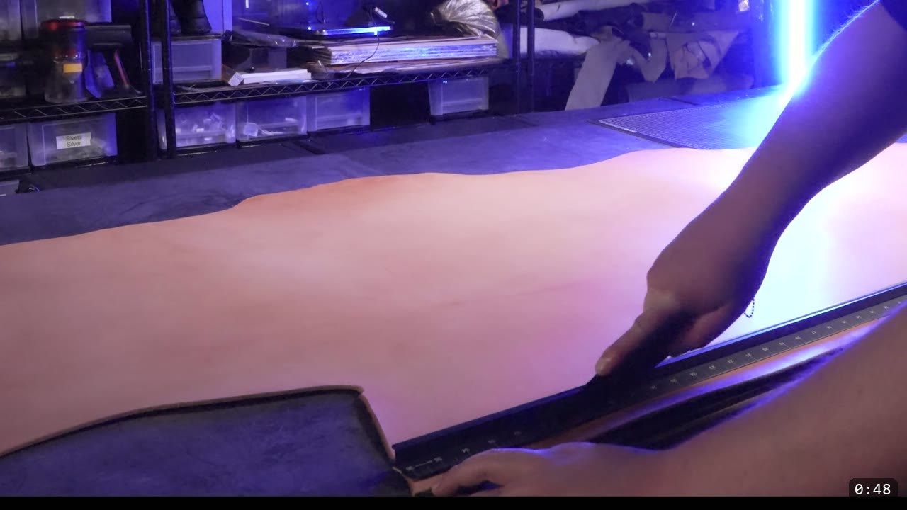Finishing the Leather Berserk Armor: The Breastplate and Tassets Build Guide 2 a full natural vegetable-tan hide laid flat on the workbench with a steel straight-edge, ready to lay out and cut the Berserk parts