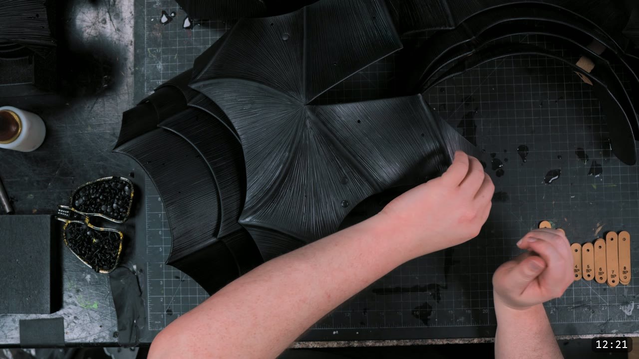 Finishing the Leather Berserk Armor: The Breastplate and Tassets Build Guide 12 assembling the black breastplate with the numbered tan retainer straps that connect the lettered panels
