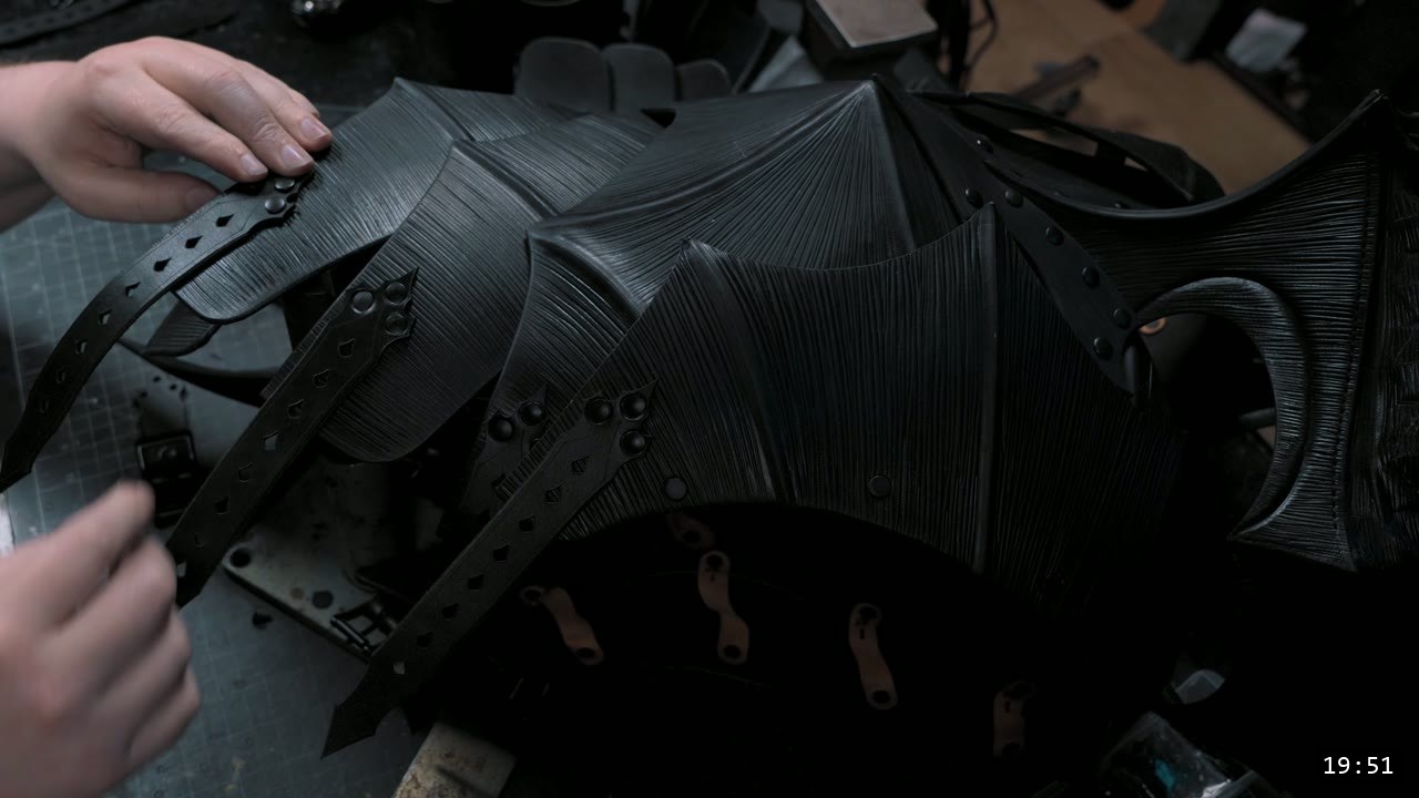 Finishing the Leather Berserk Armor: The Breastplate and Tassets Build Guide 15 riveting the retaining straps onto the finished fluted breastplate, with the front tassets hanging below