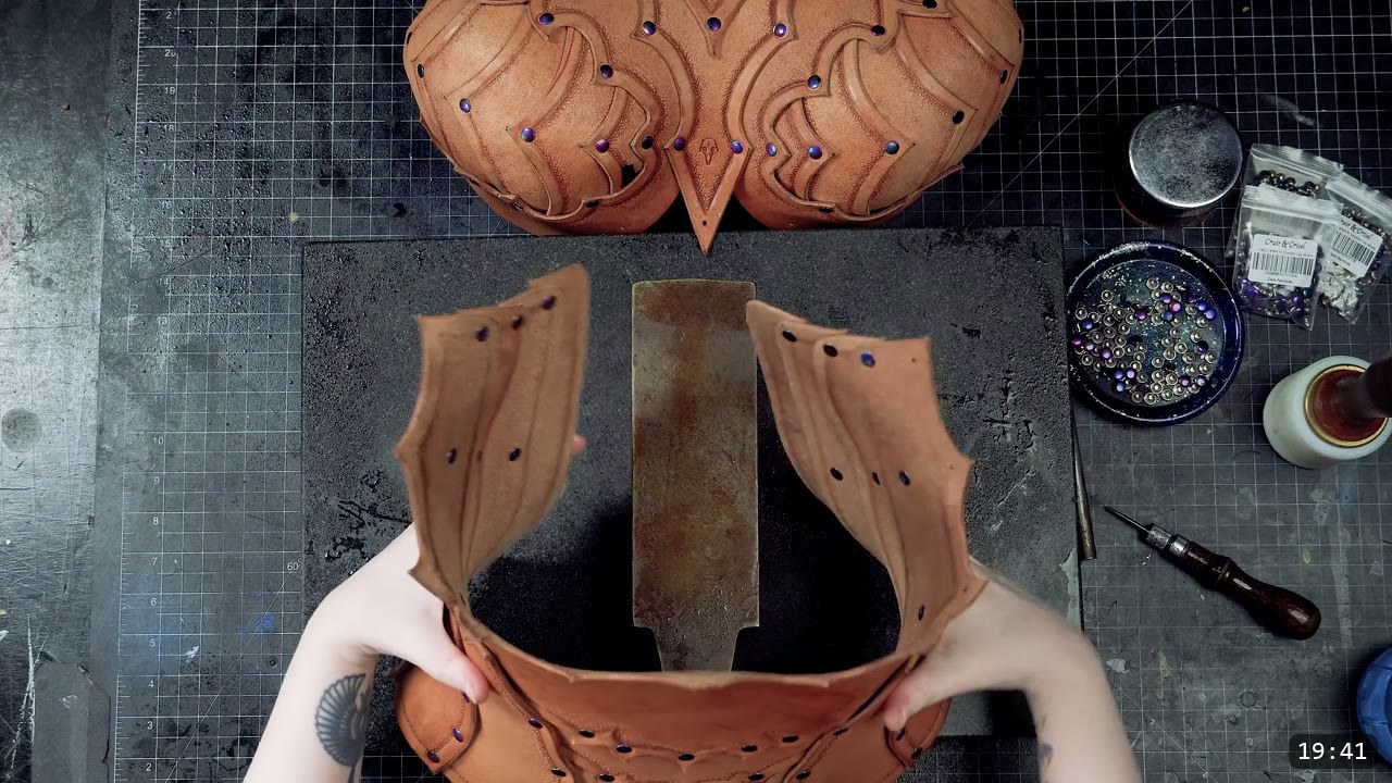 fitting two shaped side panels to the torso base with the finished tooled bust section resting above