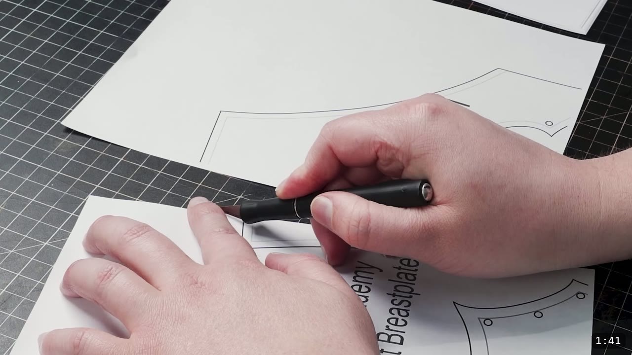 Leather Breastplate Build Guide: The Imperial Knight, Cut by Hand 4 scoring a printed Imperial Knight breastplate paper pattern on a cutting mat before transferring it to leather