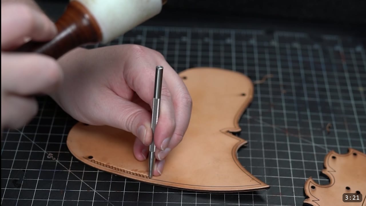 Imperial Knight Tassets Build Guide: Leather Hip Armor from a Flat Pattern 6 a mallet and a metal cedar stamp striking a row of domed impressions along the border of a tan tasset plate
