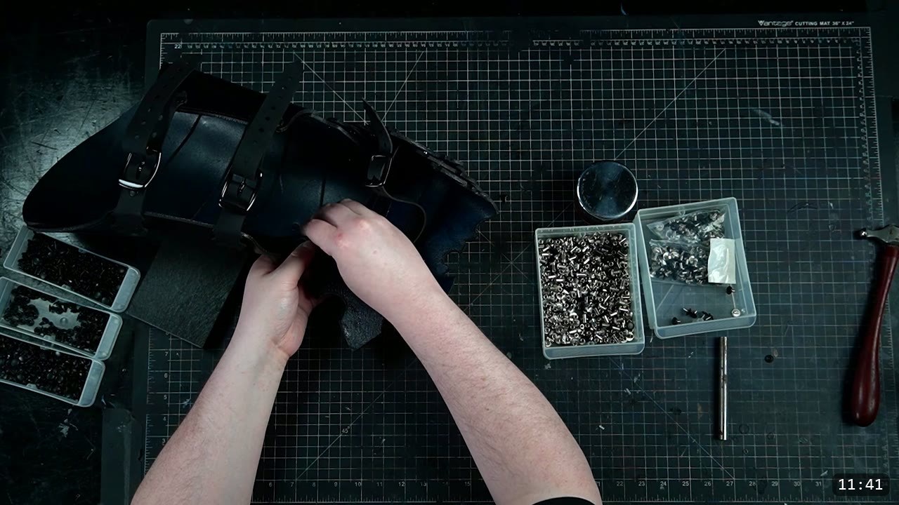 Leather Leg Armor Build Guide: Articulated Cuisses, Knees, and Greaves 13 a black leather knee cop with articulated lames above and below it and black buckle straps, hardware bins to the side
