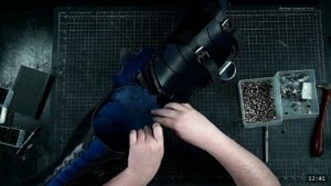 Roadmap Updates & Pre-Order Status 2 hands connecting a royal-blue cuisse to a black articulated knee and greave assembly on the bench, forming one continuous leg