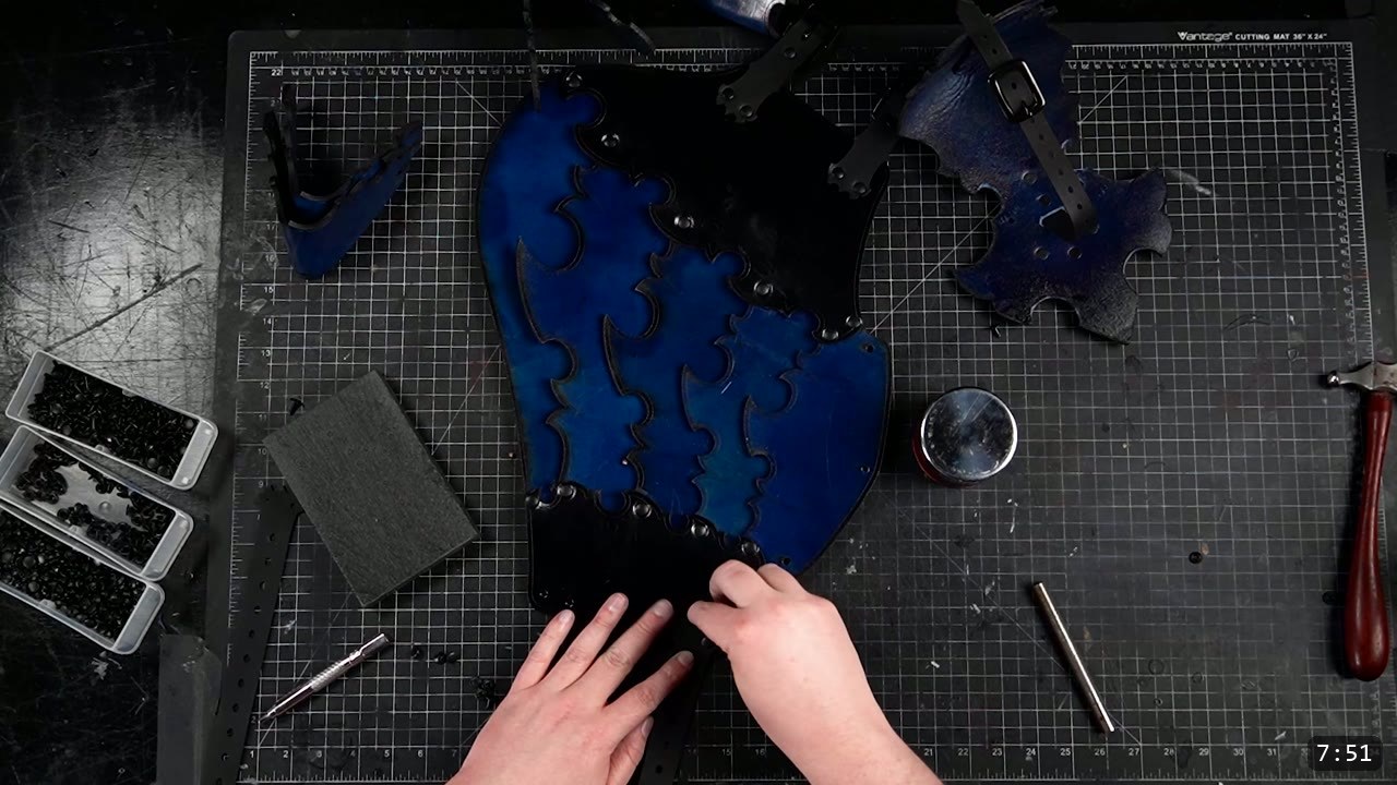 Leather Leg Armor Build Guide: Articulated Cuisses, Knees, and Greaves 9 a top-down view of a royal-blue articulated cuisse assembled flat, black rivets running along the overlapping fin-edged plates