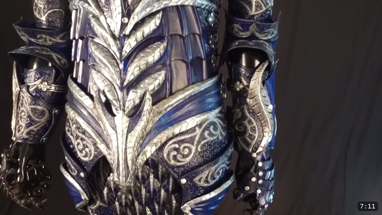 Leather Armor for Beginners: Tools You Need and How to Start 2 a finished blue and silver tooled leather fantasy armor torso and gauntlets displayed on a stand