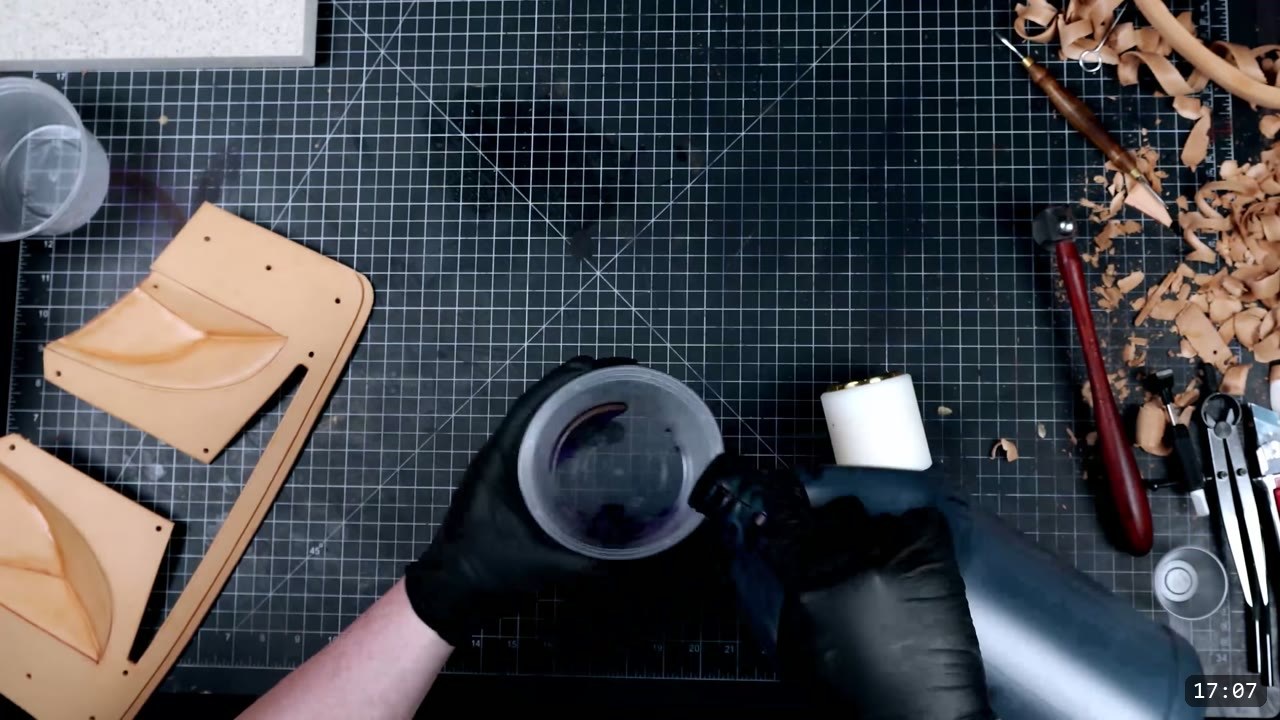 Leather Mandalorian Helmet Build Guide: Flat Pattern to Chrome Finish 11 gloved hands mixing black leather dye in a cup beside the natural cheek pieces waiting to be dyed