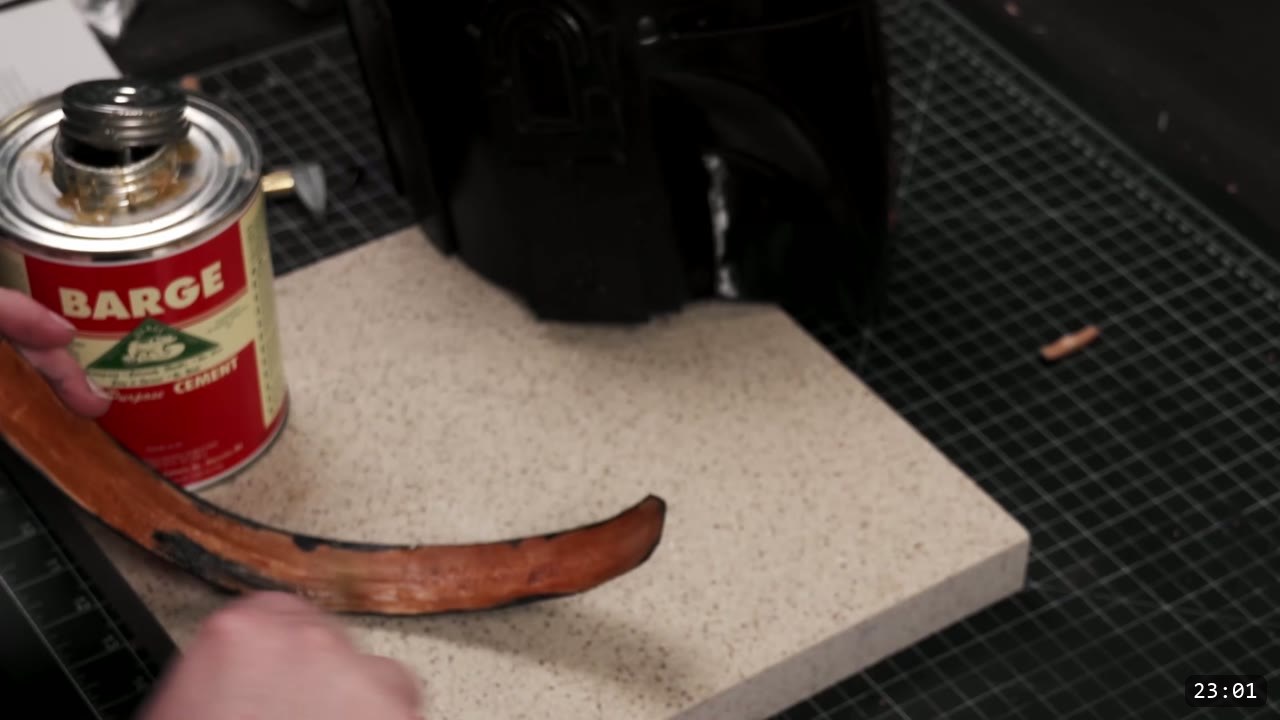 Leather Mandalorian Helmet Build Guide: Flat Pattern to Chrome Finish 14 a can of Barge cement and the glued top trim strip, with the dyed-black tooled helmet behind