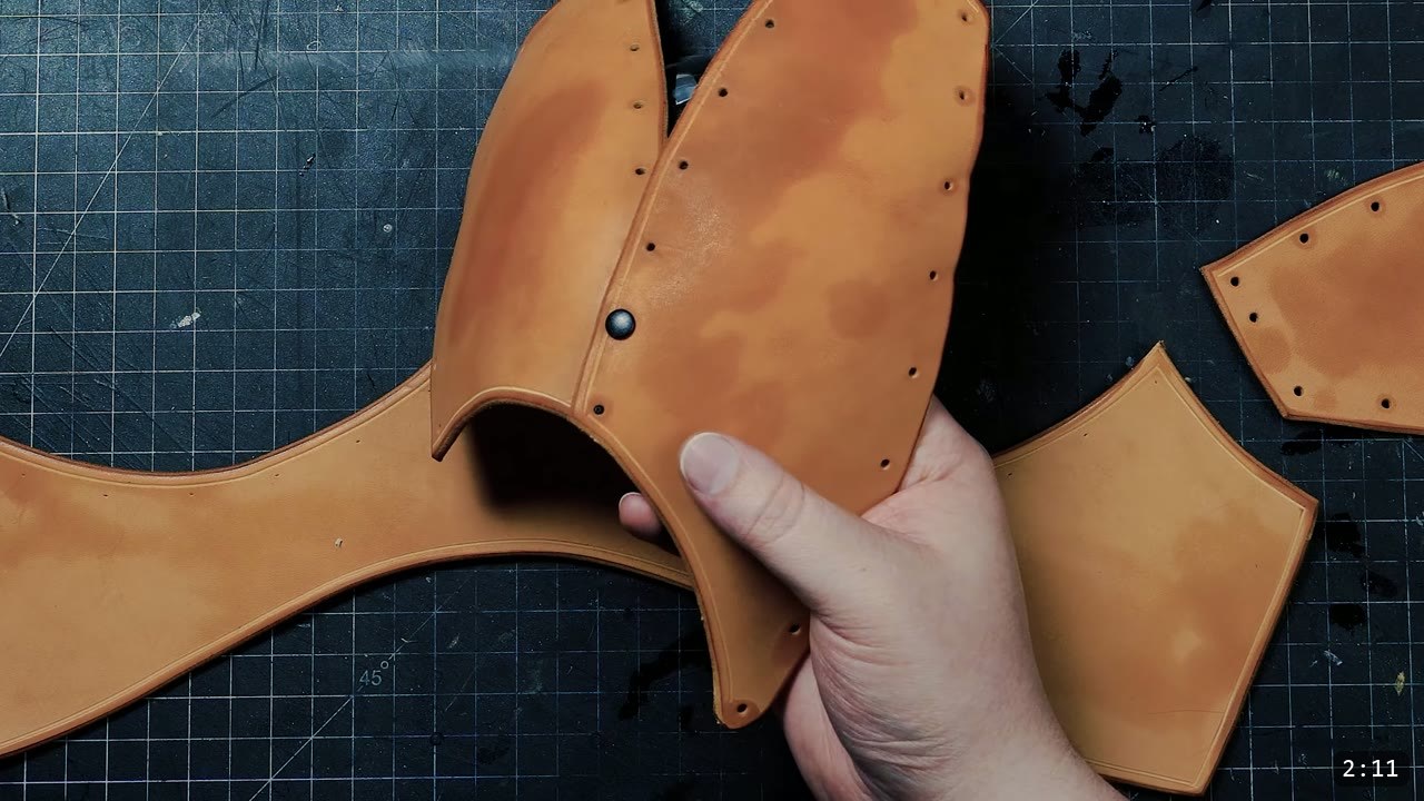 Female Leather Breastplate Build Guide: Warrior Armor from Cups to Buckles 5 two tan leather cup halves riveted together into a shallow cup, other cut pieces on the bench