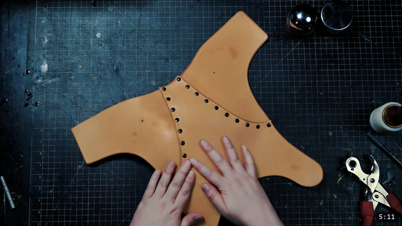 Female Leather Breastplate Build Guide: Warrior Armor from Cups to Buckles 9 pressing the assembled tan back plate flat by hand to shape it, round steel forms on the bench